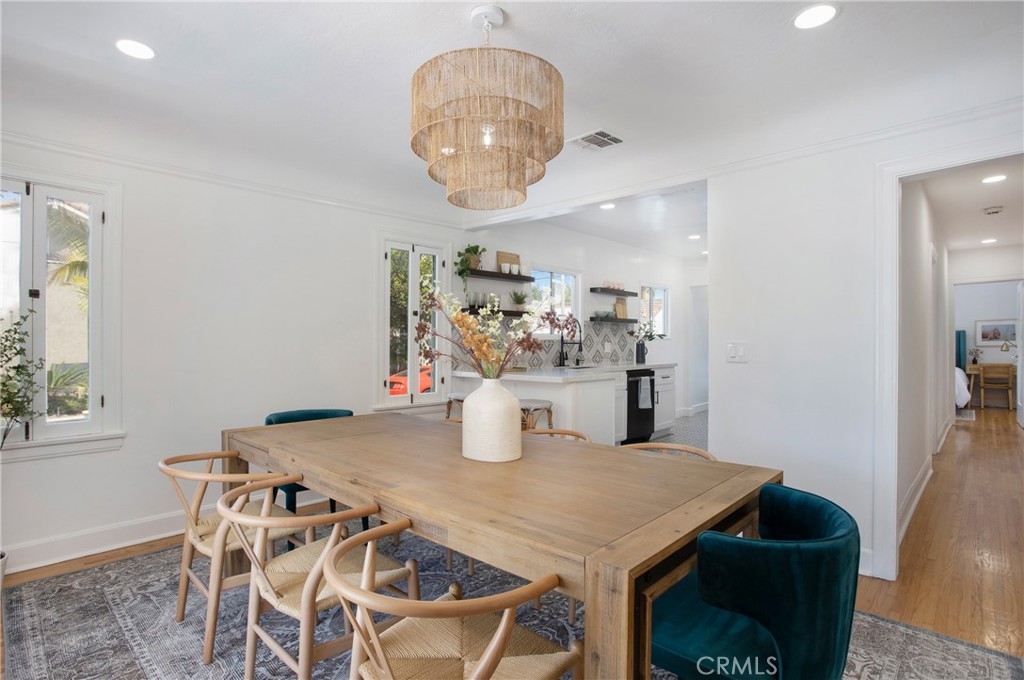 134 Prospect Avenue Long Beach, CA 90803 - Photo 9 of 21 a view of a dining room with furniture and chandelier