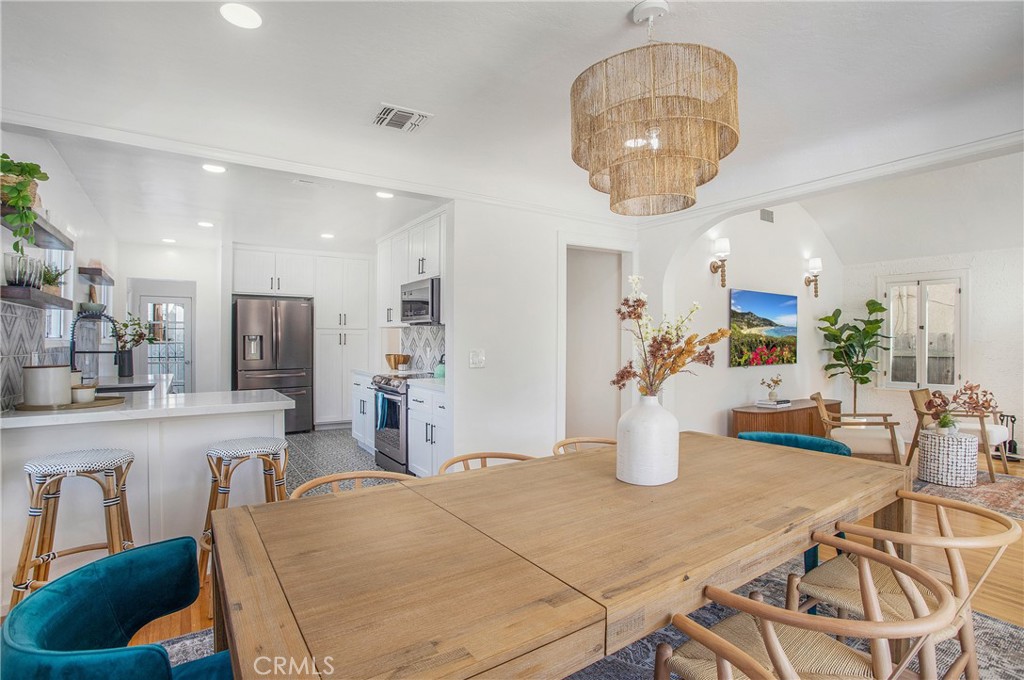 134 Prospect Avenue Long Beach, CA 90803 - Photo 10 of 21 a kitchen with a table and chairs in it