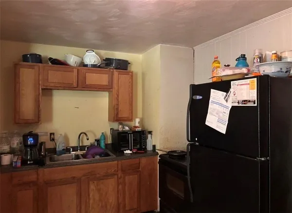 a kitchen with stainless steel appliances a sink and cabinets
