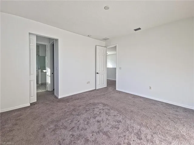 a view of an empty room and closet