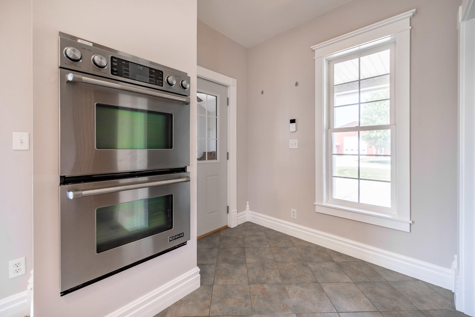 1353 Pine Hill Road Amboy, IL 61310 - Photo 15 of 91 a living room with stainless steel appliances white cabinets and a fireplace