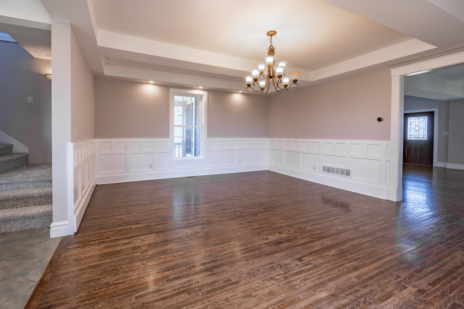 1353 Pine Hill Road Amboy, IL 61310 - Photo 19 of 91 a view of a room with wooden floors and chandelier