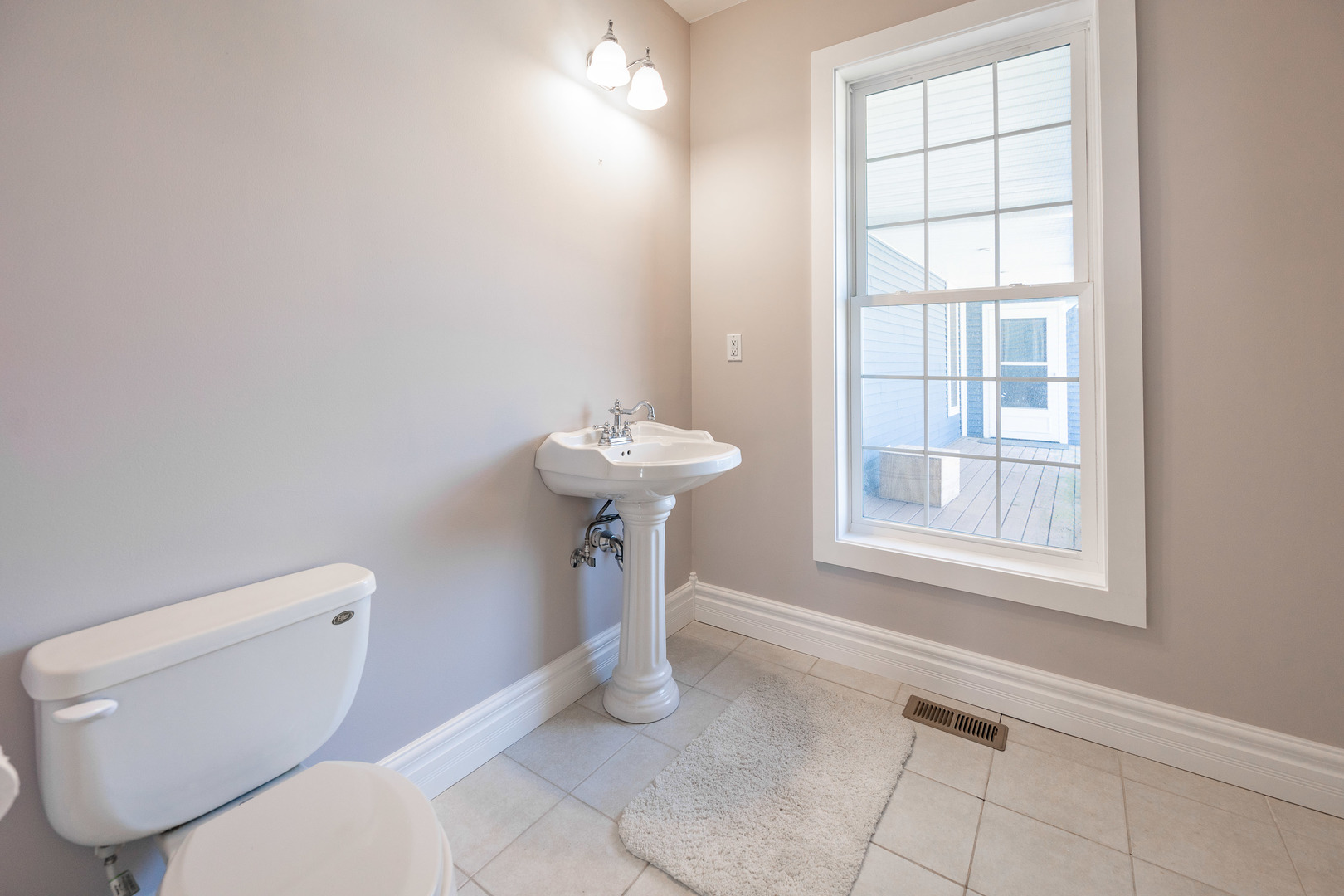 1353 Pine Hill Road Amboy, IL 61310 - Photo 25 of 91 a bathroom with a toilet sink and window