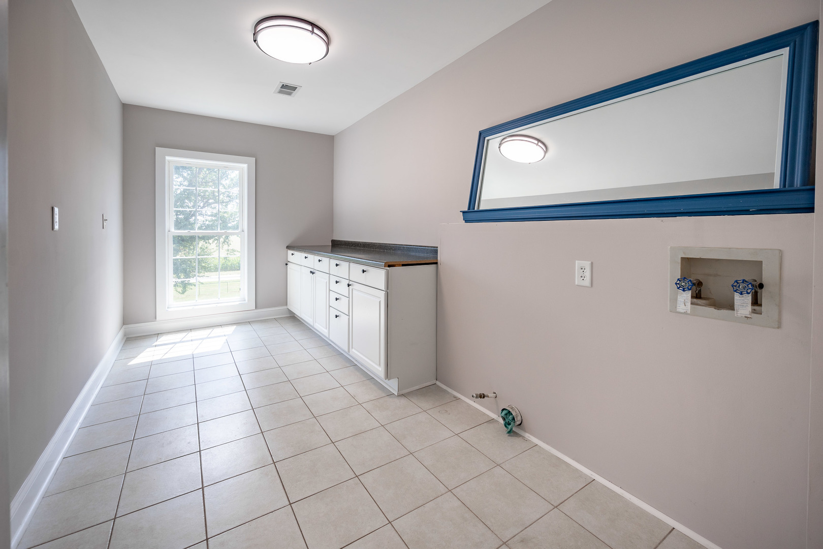 1353 Pine Hill Road Amboy, IL 61310 - Photo 36 of 91 a view of an empty room with window and cabinet