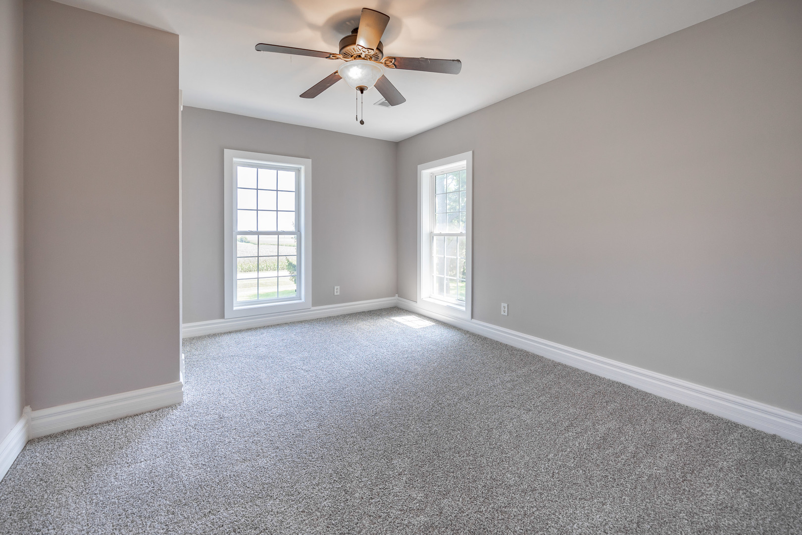 1353 Pine Hill Road Amboy, IL 61310 - Photo 39 of 91 an empty room with windows and fan