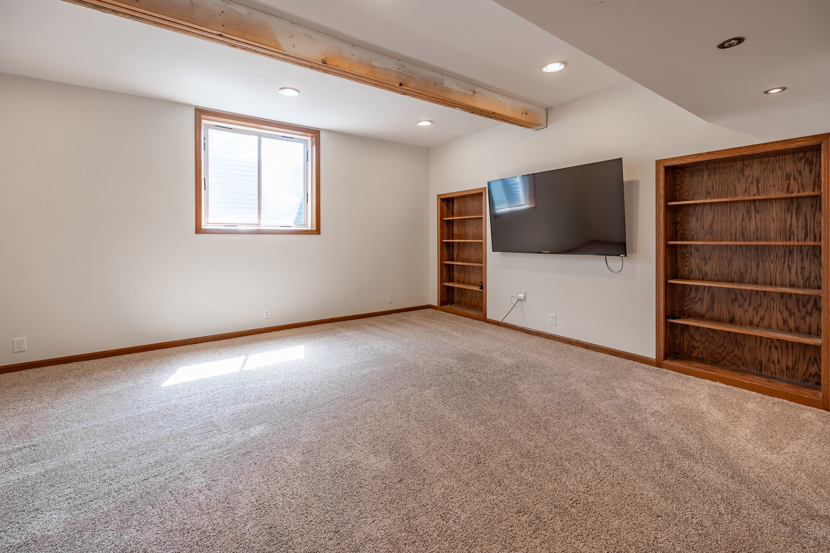 1353 Pine Hill Road Amboy, IL 61310 - Photo 50 of 91 an empty room with a flat screen tv and closet