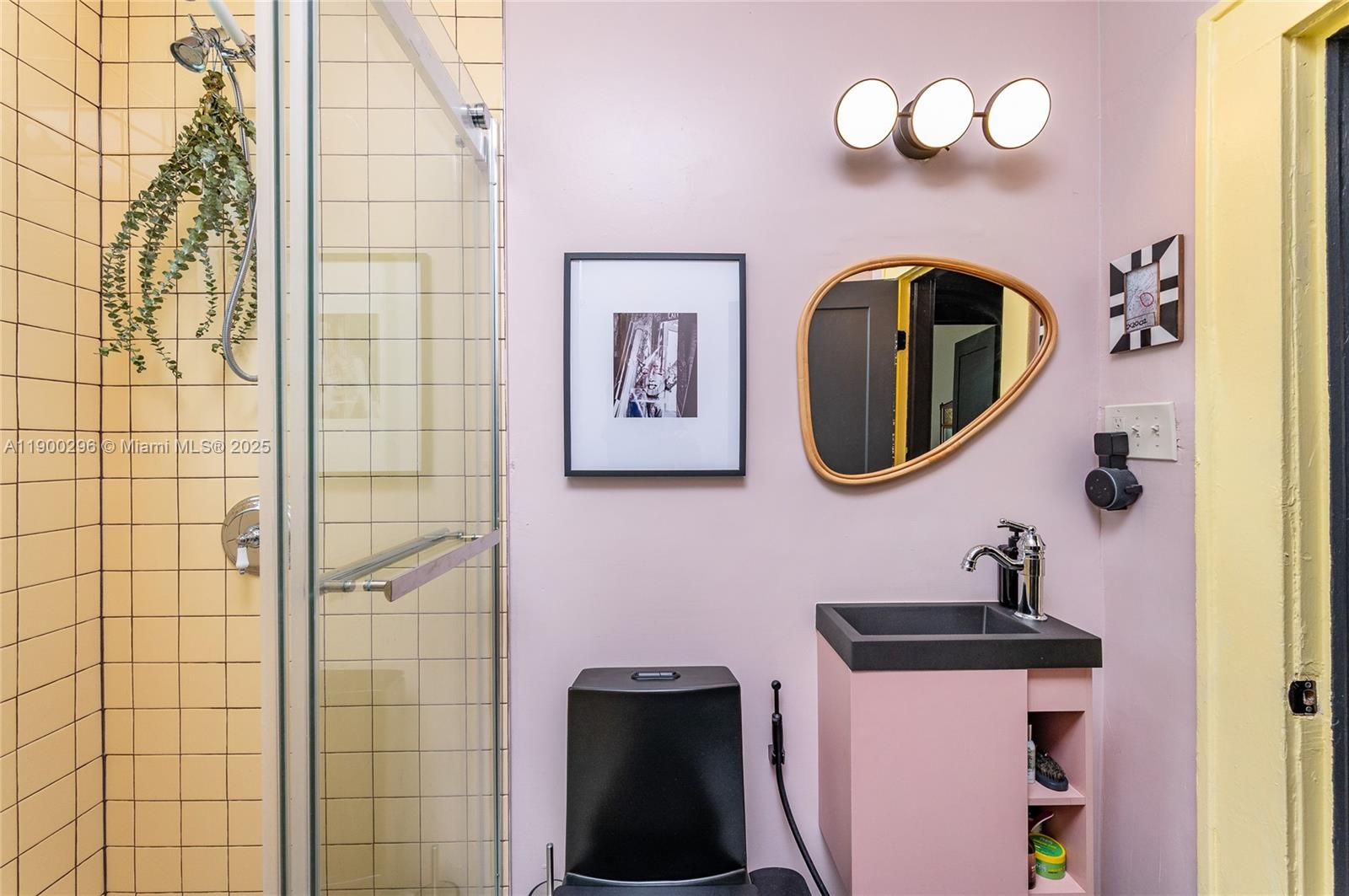 1844 Northwest 47th Street Miami, FL 33142 - Photo 14 of 24 a bathroom with a toilet sink and mirror