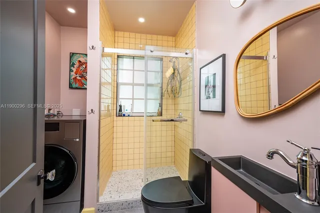 a bathroom with a sink a toilet and a mirror