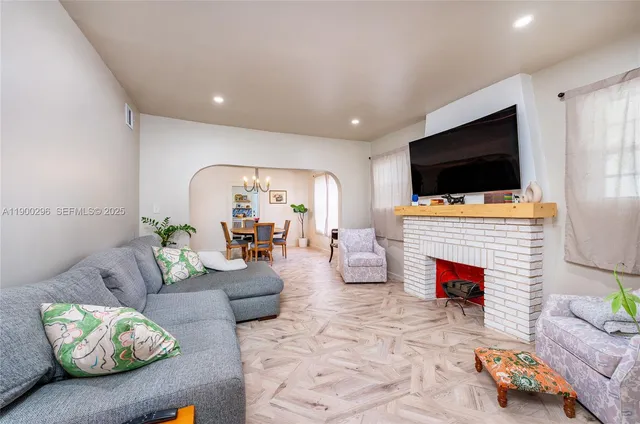 a living room with furniture and a flat screen tv