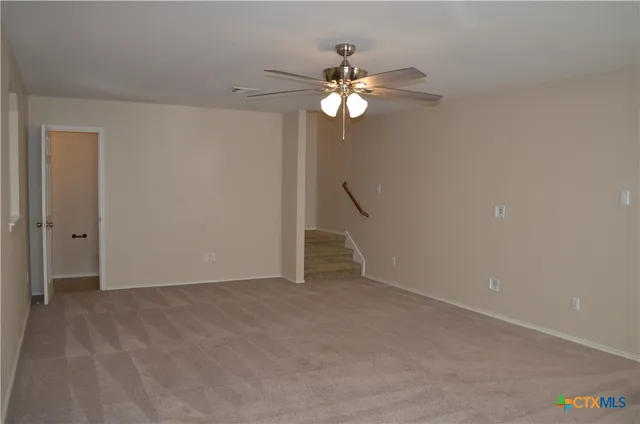 a bathroom with a toilet sink vanity and shower