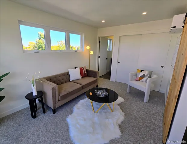 a living room with furniture and a rug