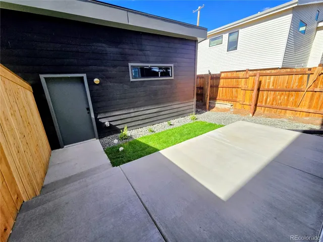 a view of backyard with a small cabin