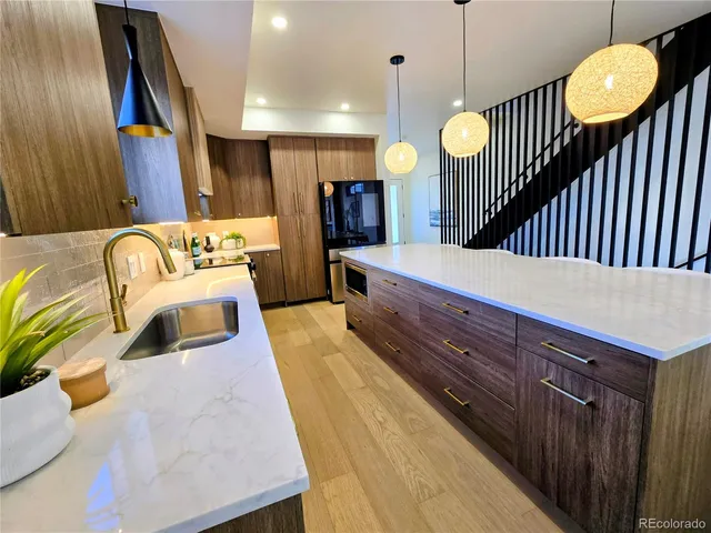 a bathroom with a sink a mirror and a shower