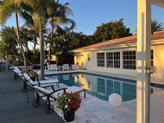 a bedroom with a bed and a chair