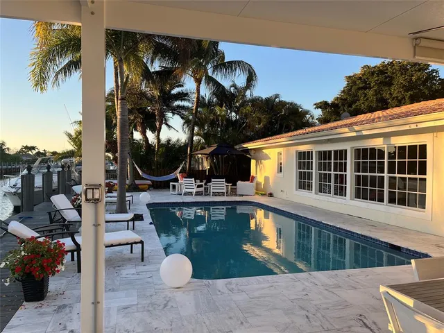a bedroom with a bed and a dresser in it