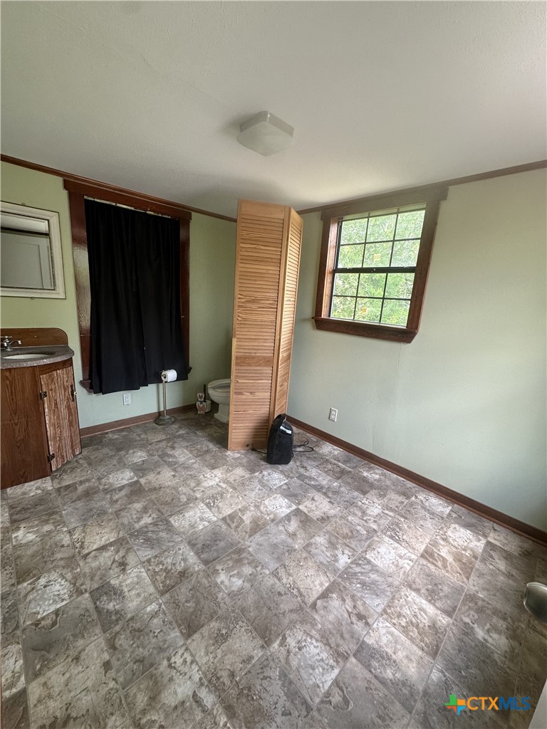 2006 Meadowlane Street Victoria, TX 77901 - Photo 12 of 15 an empty room with windows