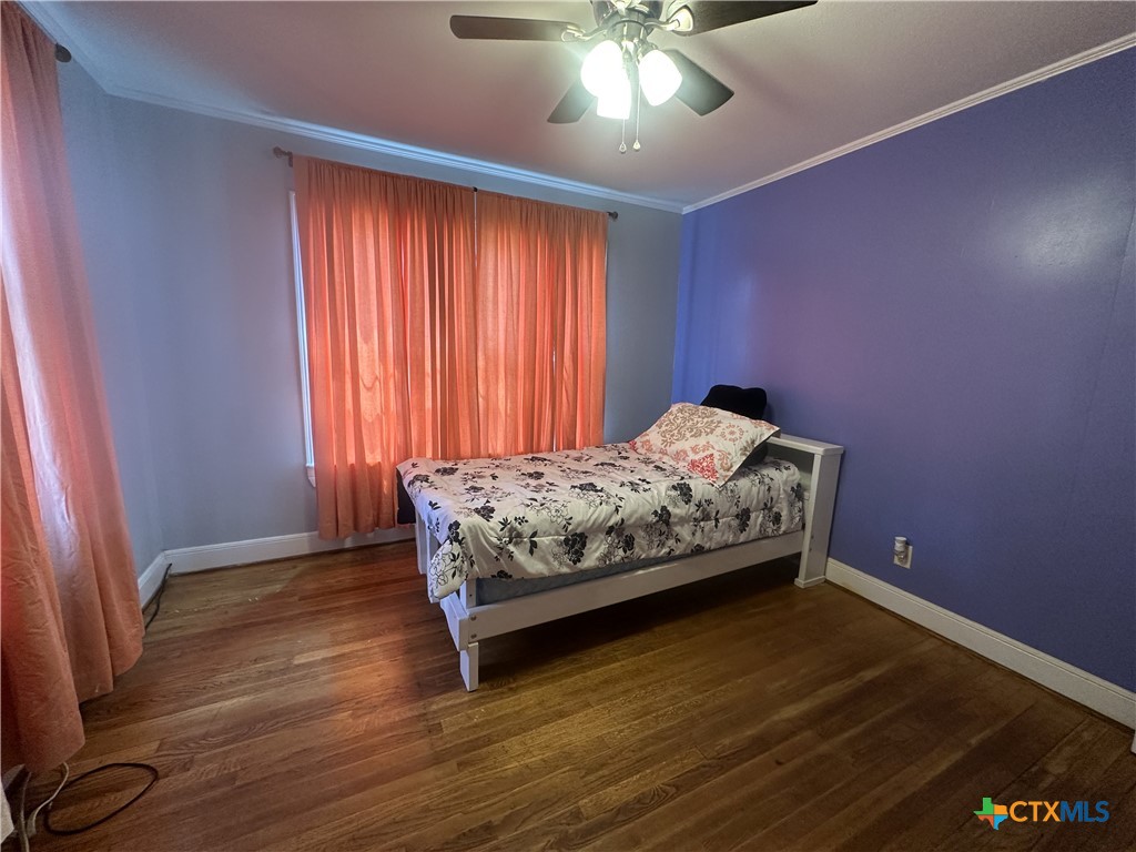 2006 Meadowlane Street Victoria, TX 77901 - Photo 8 of 15 a bedroom with a bed and window