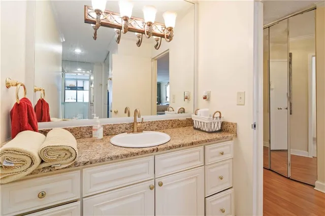 a bathroom with a sink double vanity and a mirror
