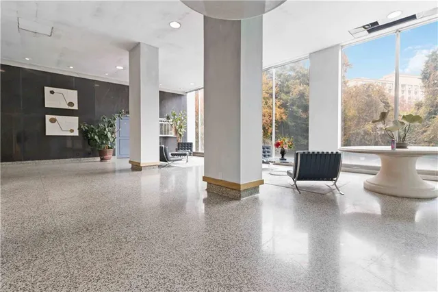 a view of a living room and a balcony