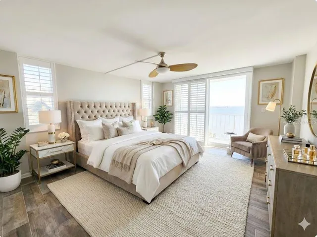 a spacious bedroom with a bed and large windows