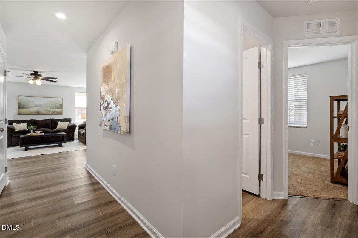 278 Hunting Wood Drive Angier, NC 27501 - Photo 10 of 36 a view of a hallway view with wooden floor and furniture