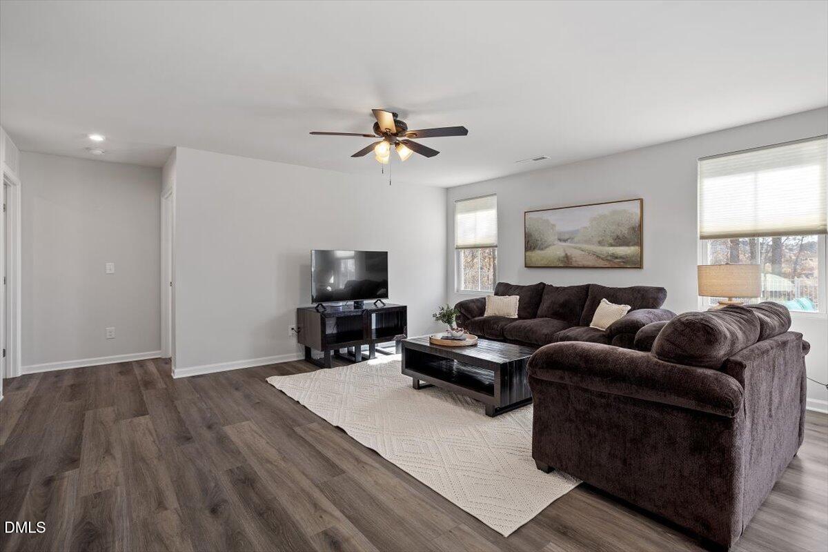 278 Hunting Wood Drive Angier, NC 27501 - Photo 16 of 36 a living room with furniture a ceiling fan and a window