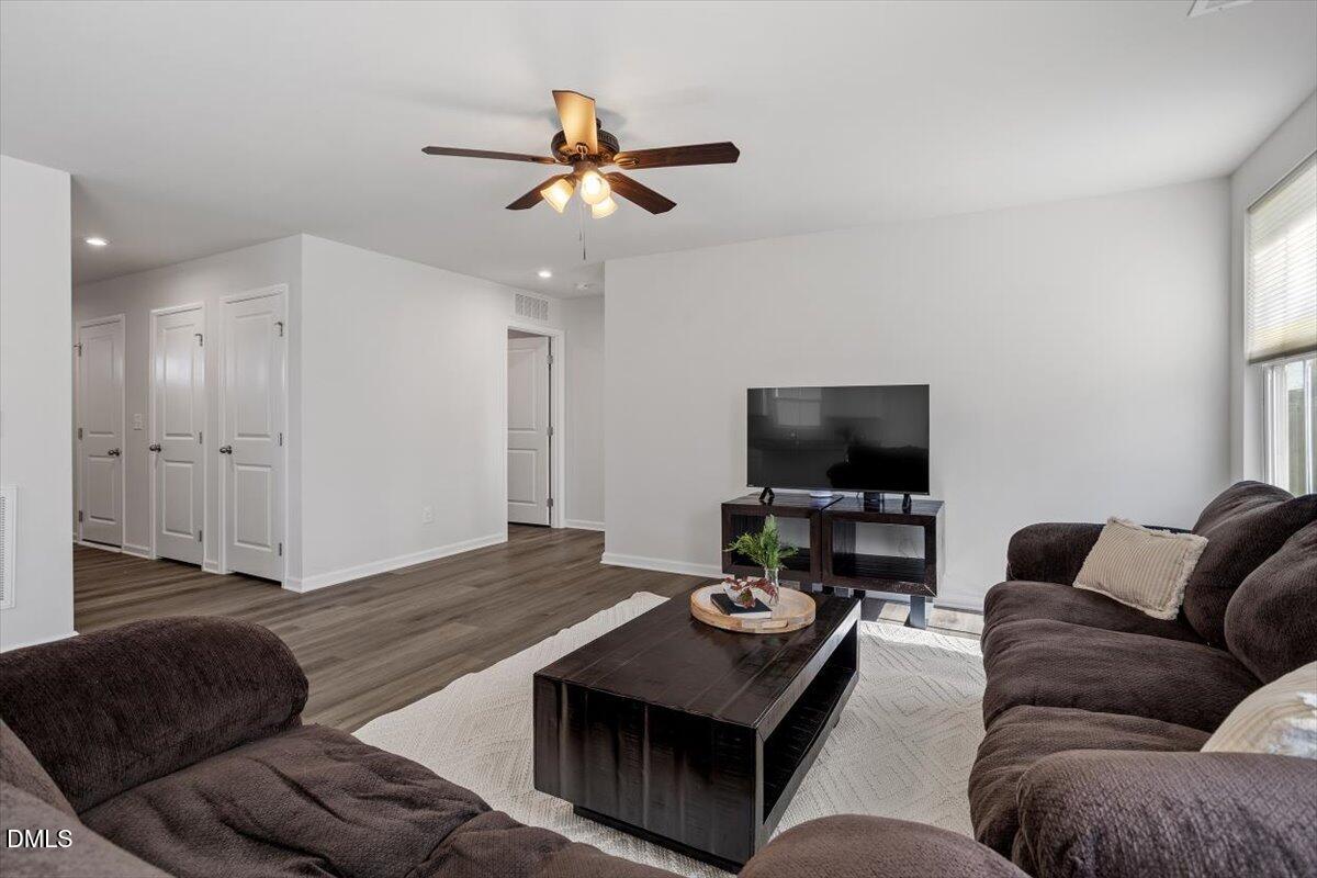 278 Hunting Wood Drive Angier, NC 27501 - Photo 17 of 36 a living room with furniture and a flat screen tv
