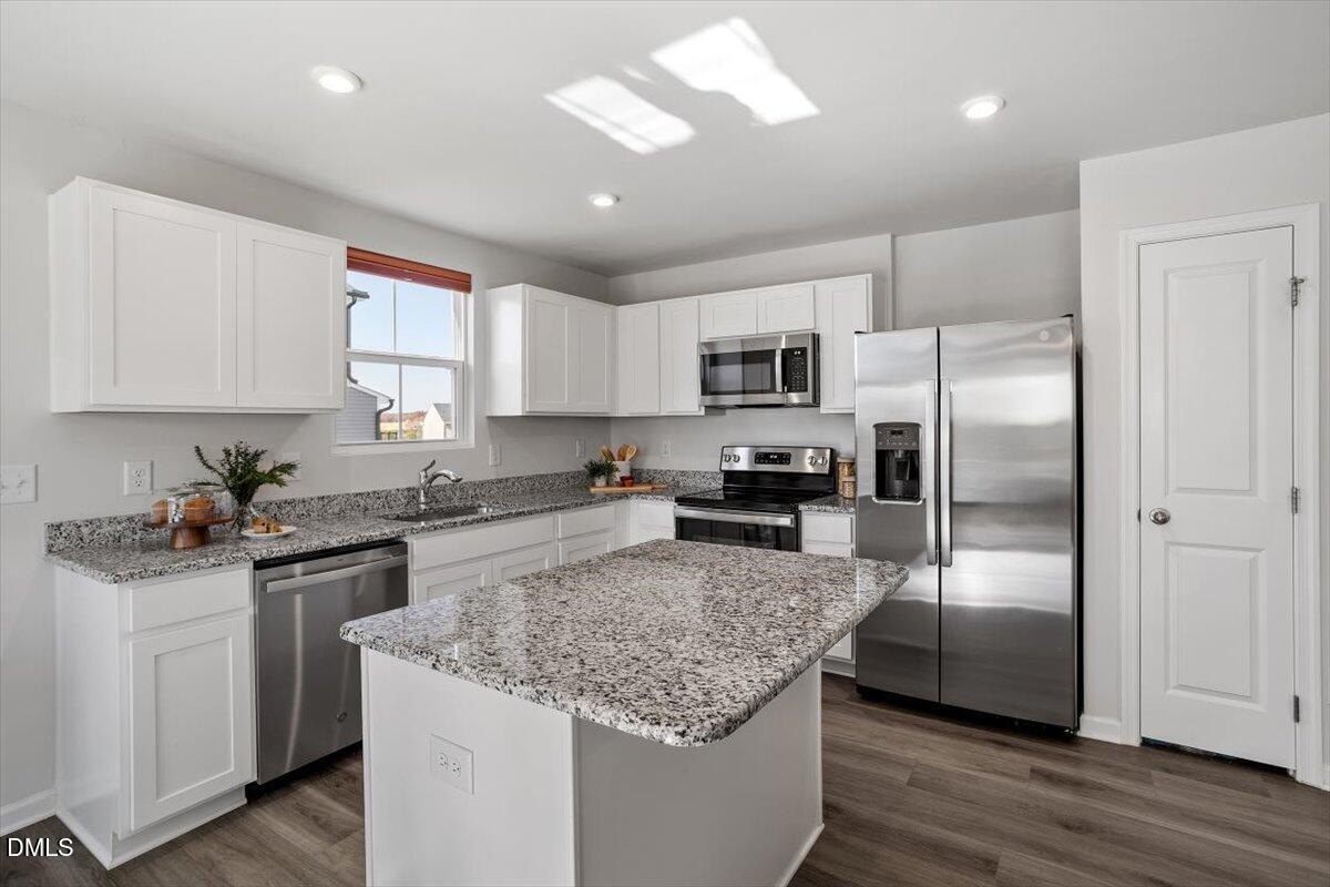 278 Hunting Wood Drive Angier, NC 27501 - Photo 21 of 36 a kitchen with a refrigerator sink and microwave