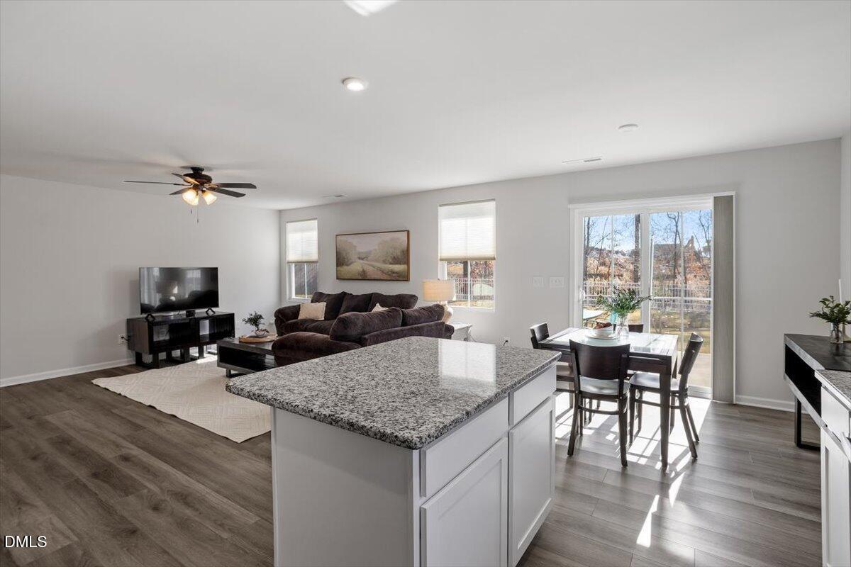 278 Hunting Wood Drive Angier, NC 27501 - Photo 25 of 36 a view of a dining room and hall with furniture window and wooden floor