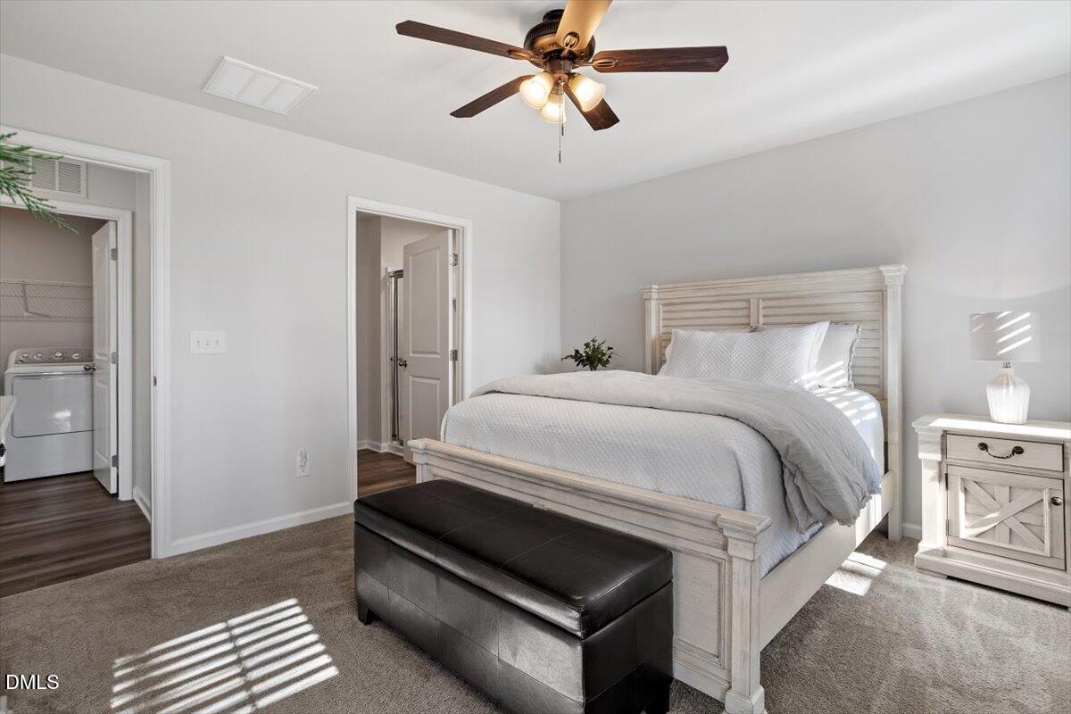 278 Hunting Wood Drive Angier, NC 27501 - Photo 30 of 36 a bedroom with a bed and wooden floor