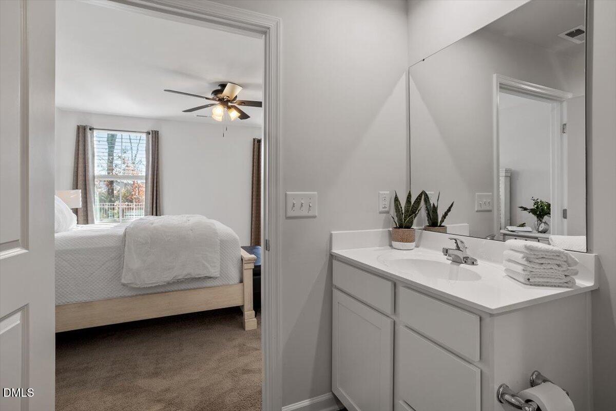 278 Hunting Wood Drive Angier, NC 27501 - Photo 34 of 36 a en suite bathroom with a double vanity sink and mirror