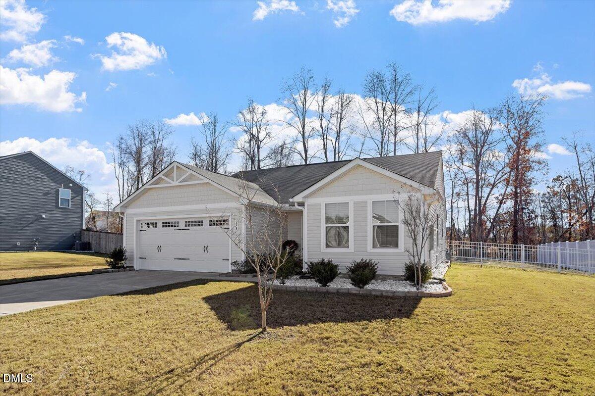 278 Hunting Wood Drive Angier, NC 27501 - Photo 3 of 36 a front view of a house with a yard
