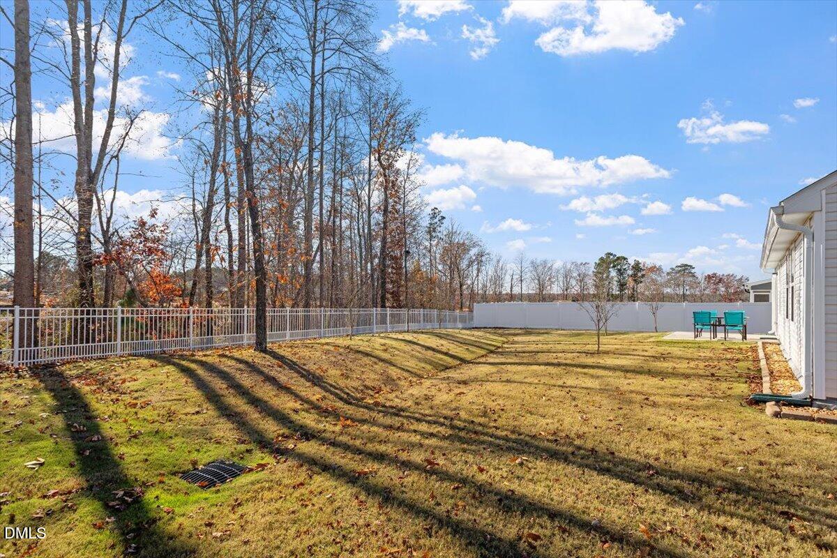 278 Hunting Wood Drive Angier, NC 27501 - Photo 6 of 36 a view of a swimming pool with a patio