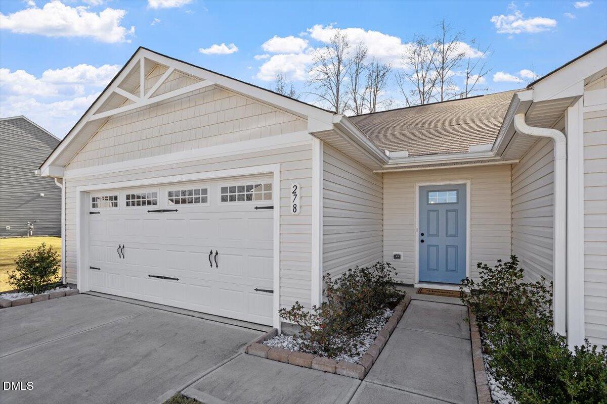 278 Hunting Wood Drive Angier, NC 27501 - Photo 9 of 36 a view of a house with a garage