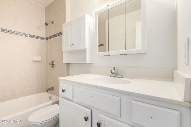 a bathroom with a sink a toilet and a bathtub