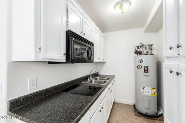 a kitchen with a stove and a microwave