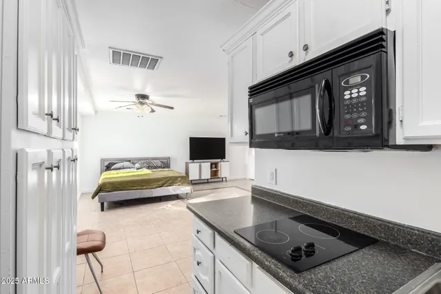 a kitchen with a stove and a microwave