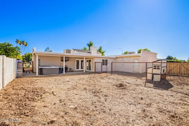 a view of a house with a snow in the background