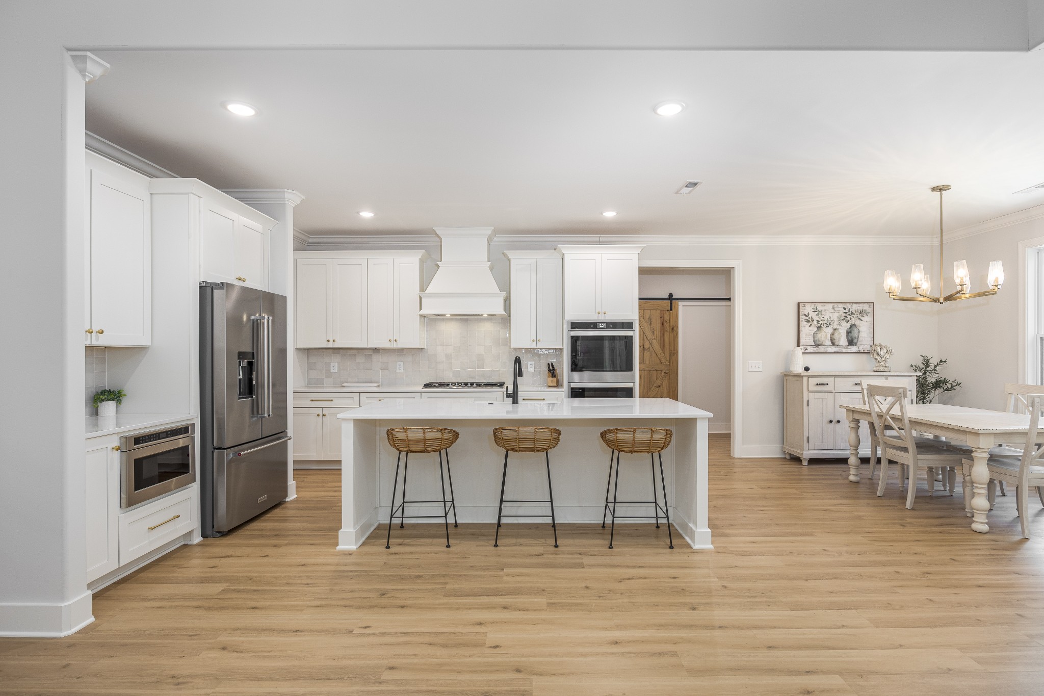 2159 Carpenter Bridge Road Columbia, TN 38401 - Photo 14 of 72 a kitchen with stainless steel appliances a dining table chairs refrigerator and sink