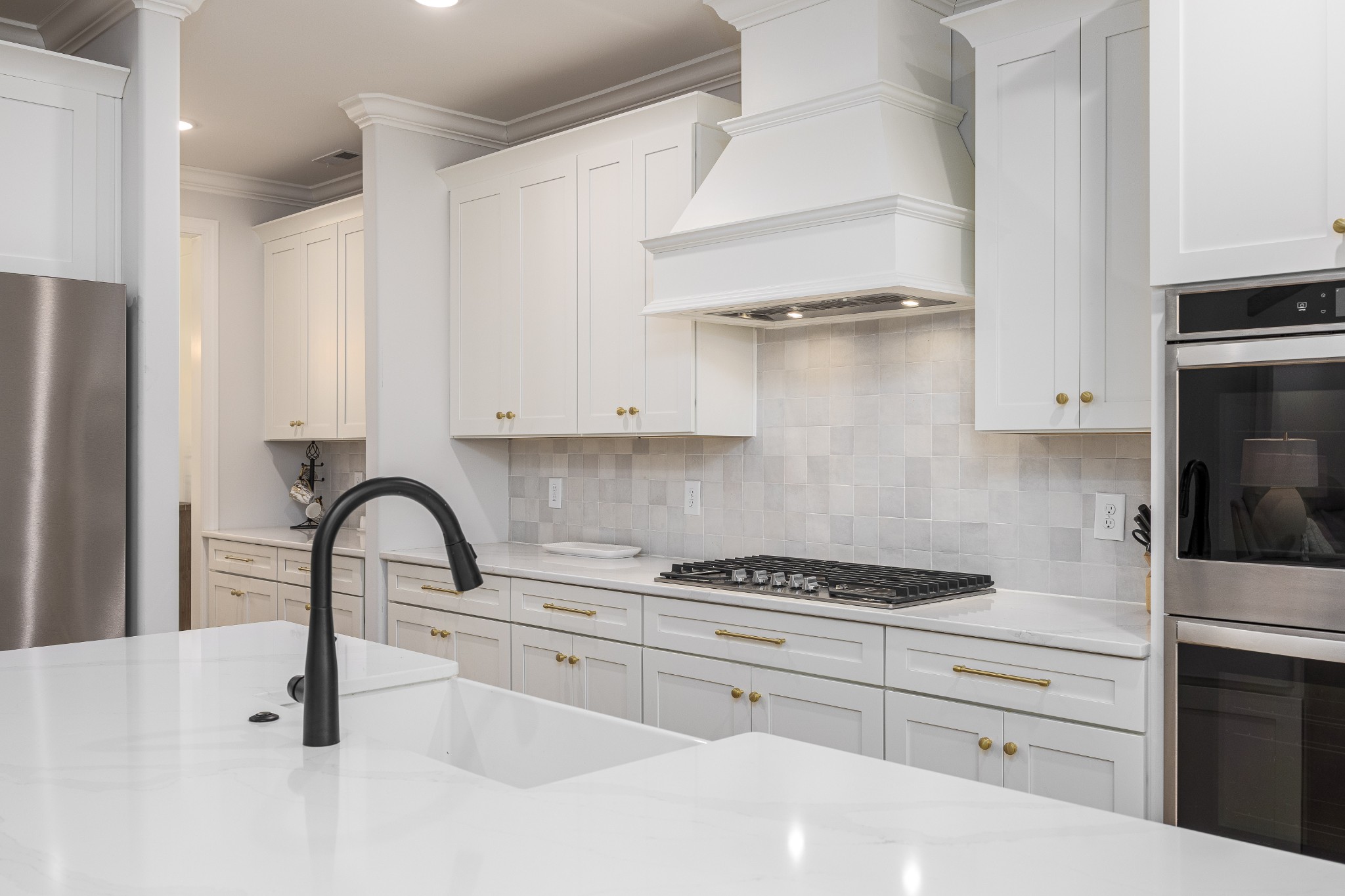 2159 Carpenter Bridge Road Columbia, TN 38401 - Photo 18 of 72 a kitchen with granite countertop a white stove and cabinets