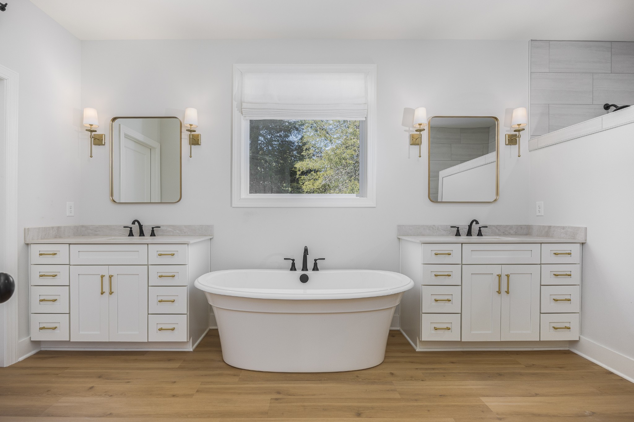 2159 Carpenter Bridge Road Columbia, TN 38401 - Photo 35 of 72 a spacious bathroom with double vanity sink a two mirror a window and a bathtub