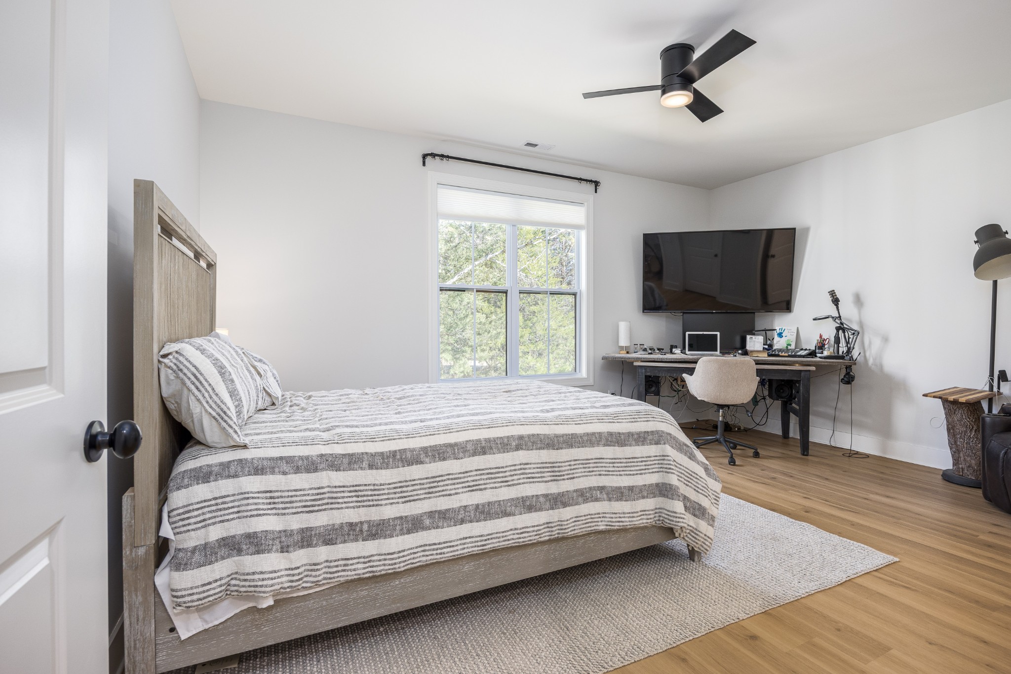 2159 Carpenter Bridge Road Columbia, TN 38401 - Photo 39 of 72 a bedroom with a bed a chair and a flat screen tv