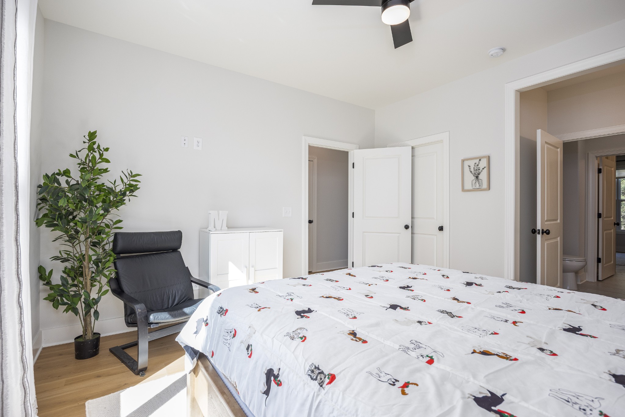 2159 Carpenter Bridge Road Columbia, TN 38401 - Photo 44 of 72 a bedroom with a bed and a potted plant