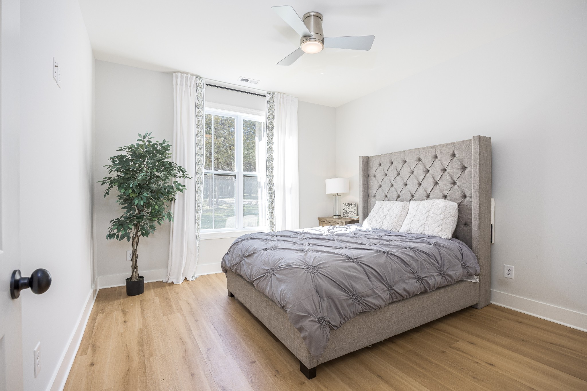 2159 Carpenter Bridge Road Columbia, TN 38401 - Photo 46 of 72 a bedroom with a bed and a potted plant