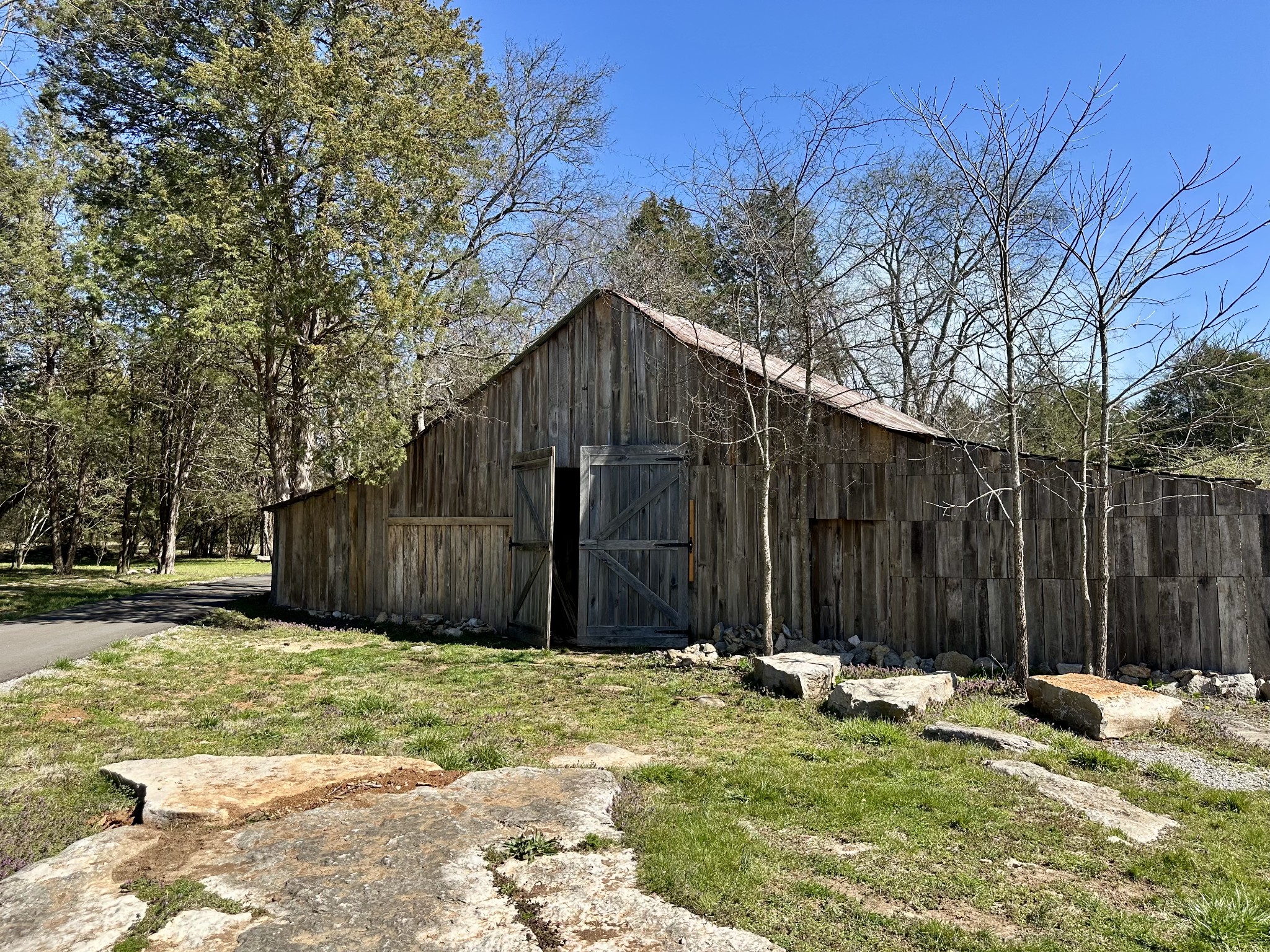 2159 Carpenter Bridge Road Columbia, TN 38401 - Photo 67 of 72 a view of a backyard with large trees and wooden fence