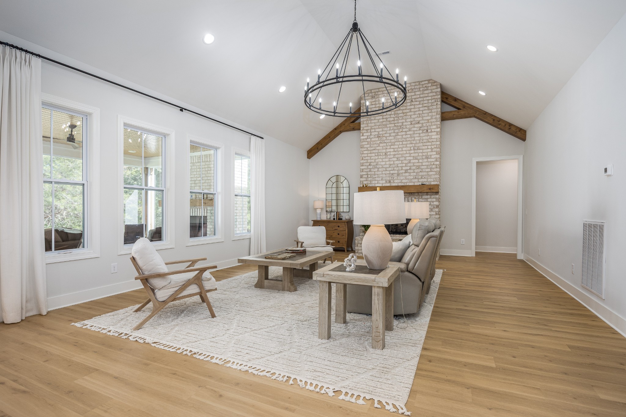 2159 Carpenter Bridge Road Columbia, TN 38401 - Photo 10 of 72 a living room with couches chandelier and kitchen view with wooden floor