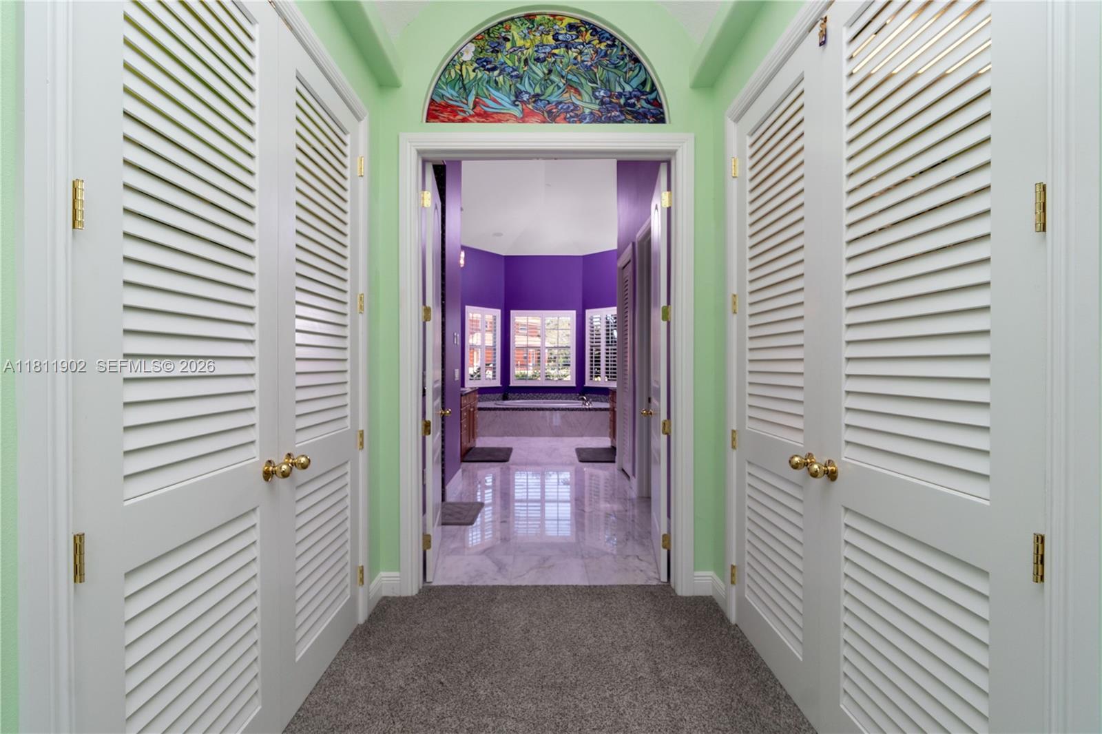 37511 Washington Loop Road Punta Gorda, FL 33982 - Photo 21 of 50 Hallway from Master bedroom to Master bath