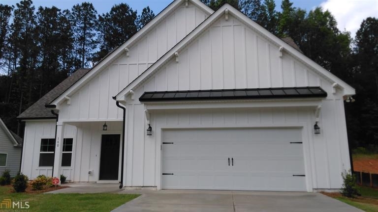 185 S Ridge, Unit 45 Senoia, GA 30276 - Photo 1 of 1 a house view with a garden space