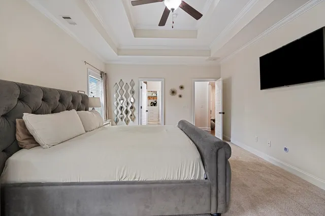 a spacious bathroom with a granite countertop sink mirror and shower