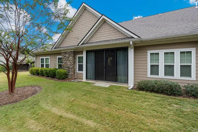 a view of a house with garden and yard